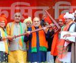 Union Home Minister Amit Shah is presented with a 'Plough' during a public rally