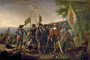 Christopher Columbus and members of his crew are shown on a beach in the West Indies, the first landfall of their expedition to find a westward route from Europe to China