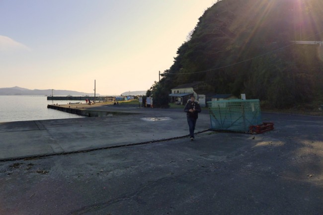 man walking up doc in japan