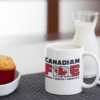 Canadian Fire Coffee Mug beside milk and muffins