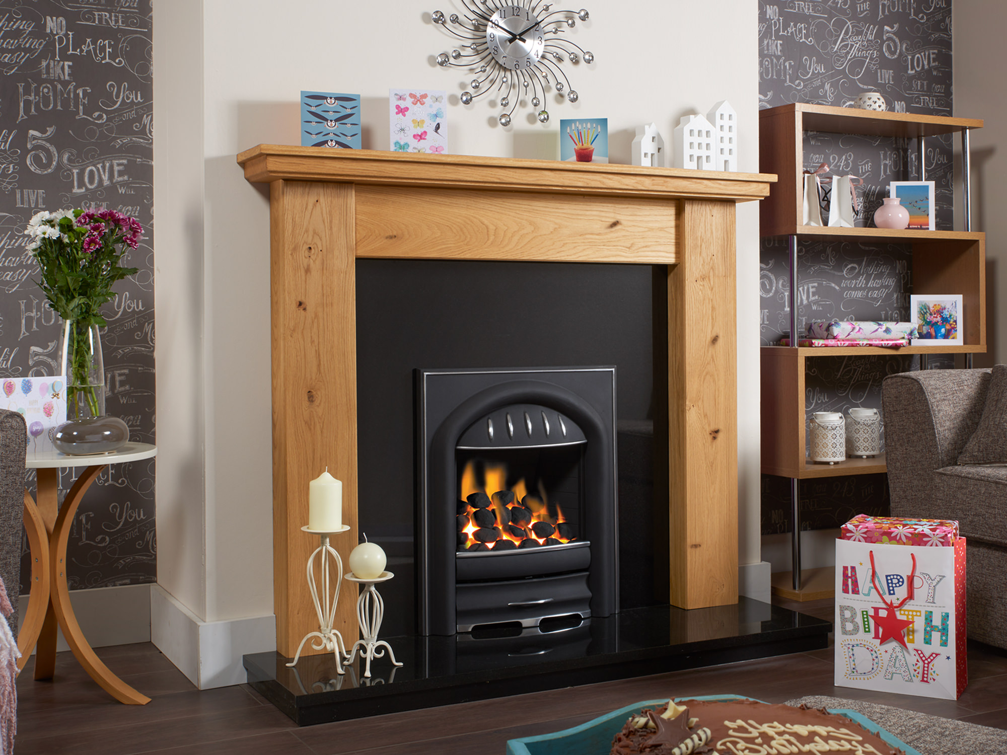 Traditional rustic oak fireplace surround, in light oiled oak with a white wall, dark brown laminate flooring.