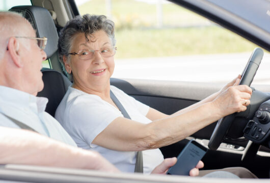 Elderly couple in a rental car