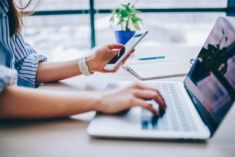 woman shopping online with laptop and smartphone