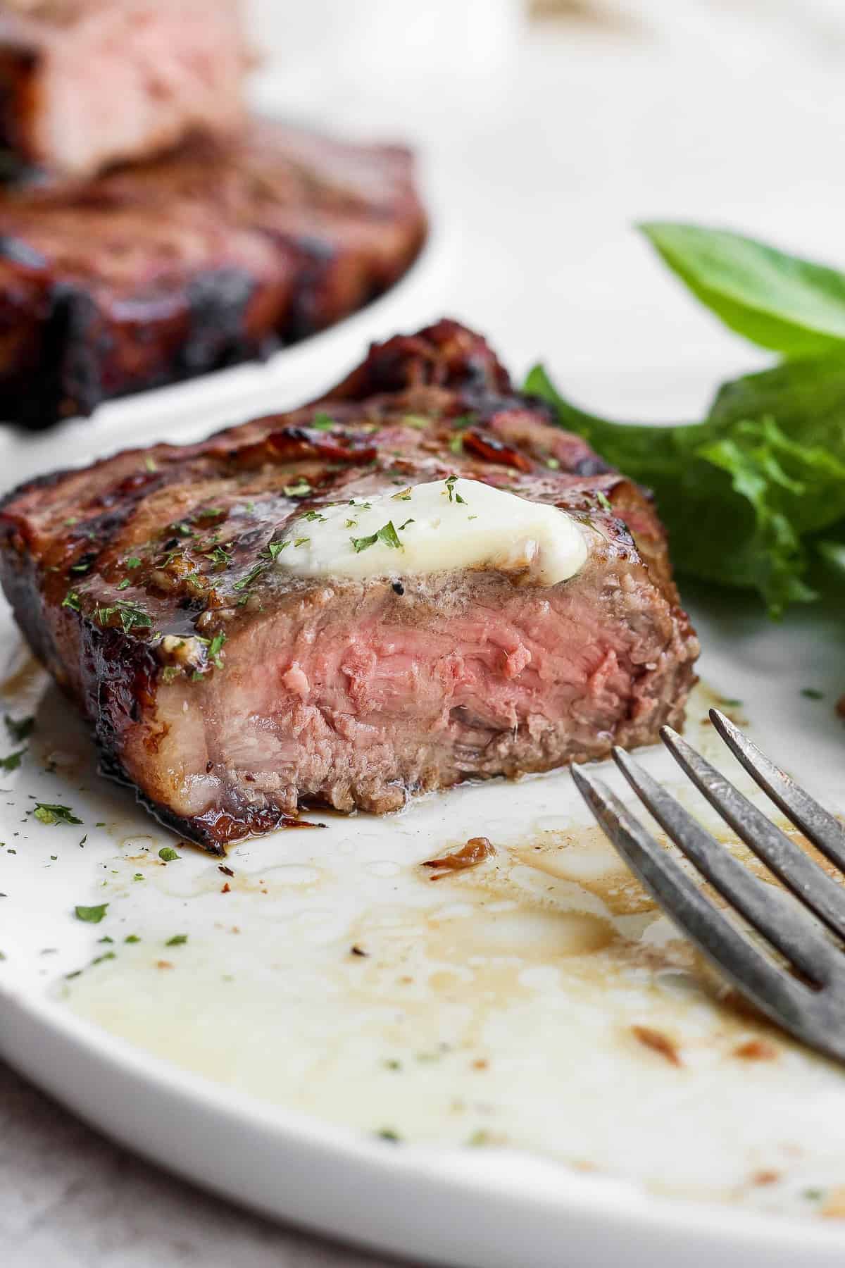 steak sliced into with butter.