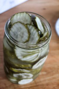 Quick & Easy Keto Refrigerator Pickles are bursting with tangy dill and garlic flavor, a kick of spice, and super crunchy. Homemade pickles made in the refrigerator - better than the grocery store, and better for you!