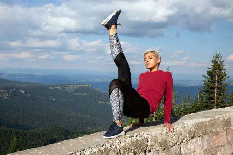 Woman Doing Exercise On Altitude