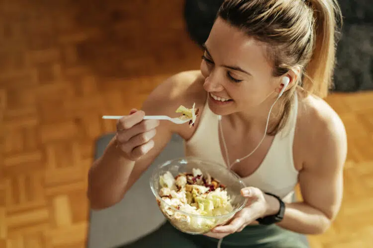 Athletic Woman Enjoying in Healthy Food