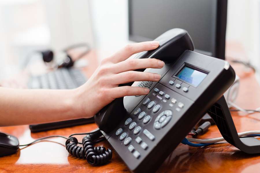 woman hand picking up the telephone