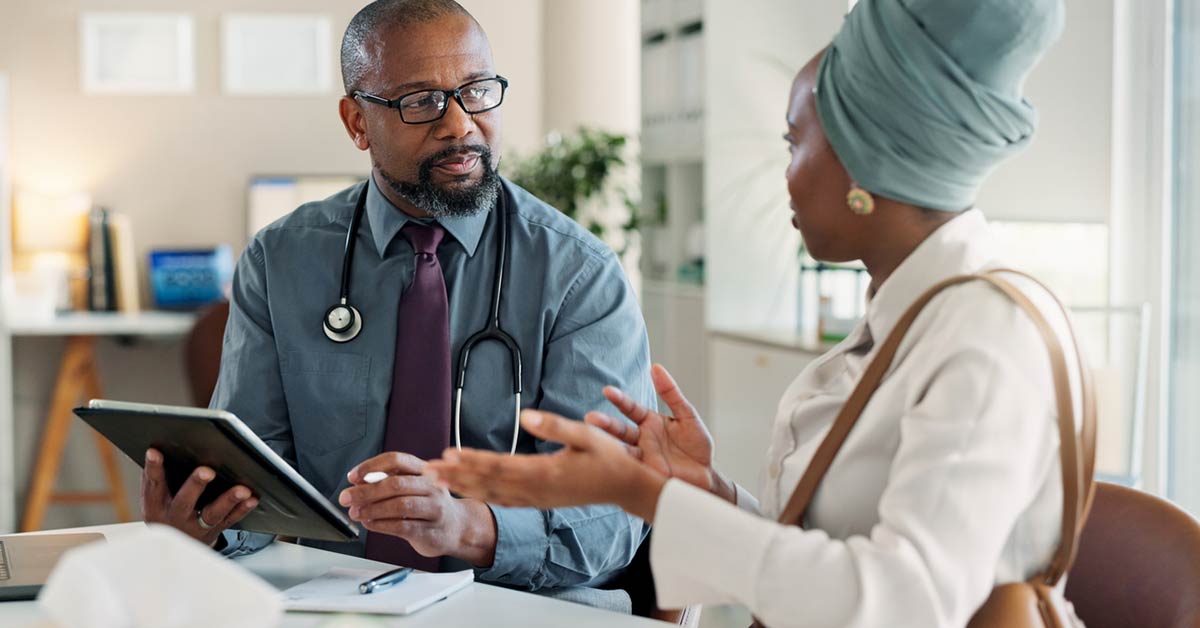 black doctor and patient