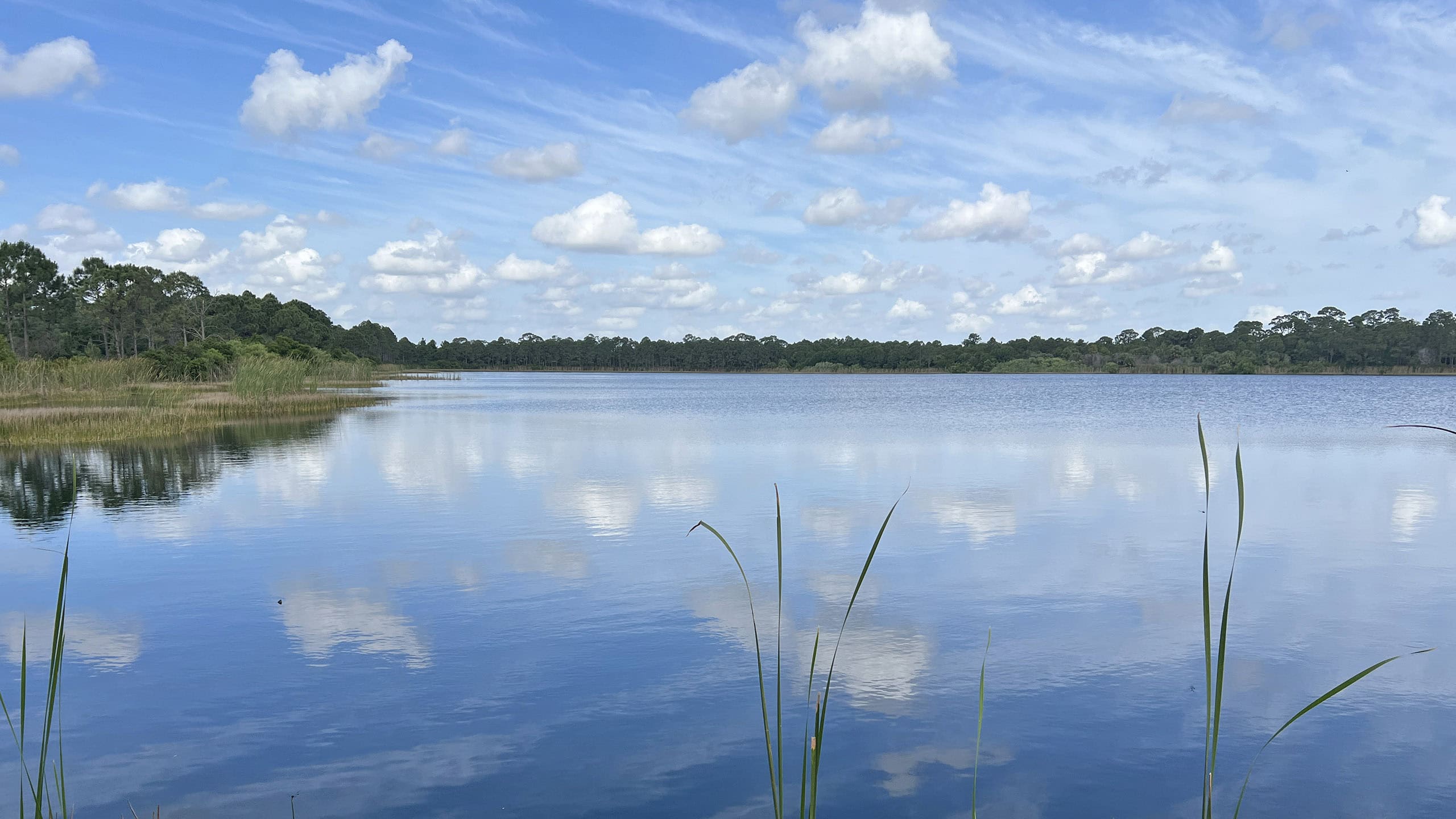 Broad lake with cloud reflections