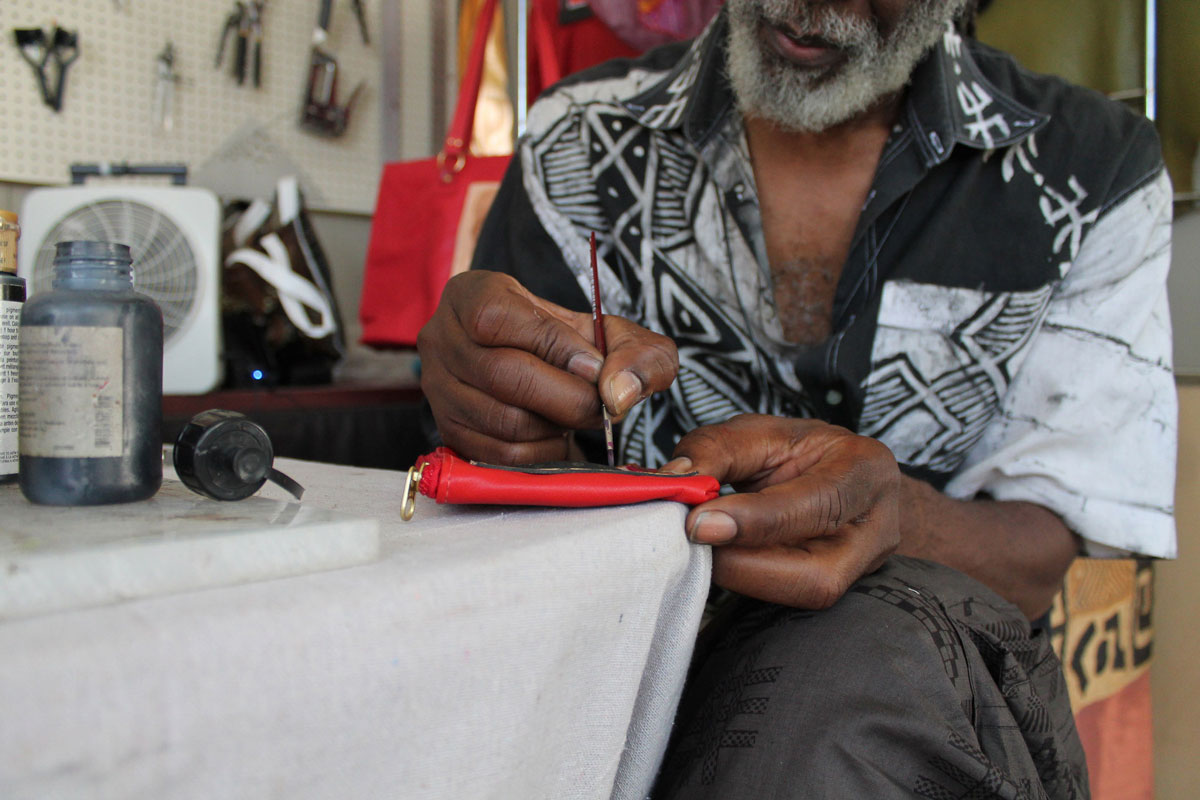 Artisan of style Marvin Sin demonstrates leatherwork at the 2013 Festival.