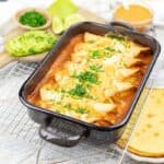 A pan of baked chicken enchiladas casserole.