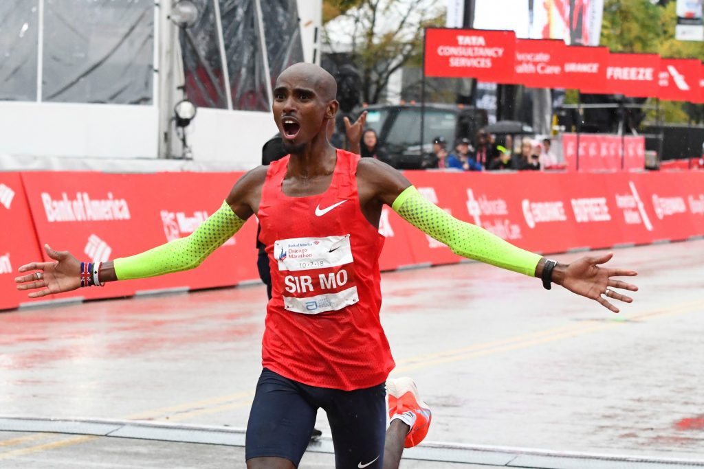 Mo Farah of Great Britain, raises his arm after he finishes in first place during the Bank of America Chicago Marathon, in ChicagoMarathon, Chicago, USA - 07 Oct 2018