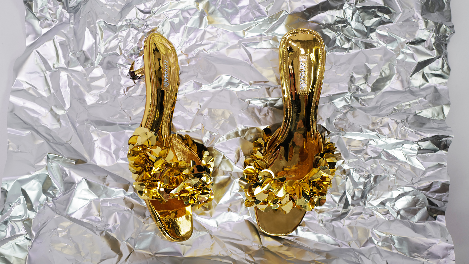 Larroude comfortable party shoes mules kitten heels for holiday in gold with sequins on a silver backgrounf