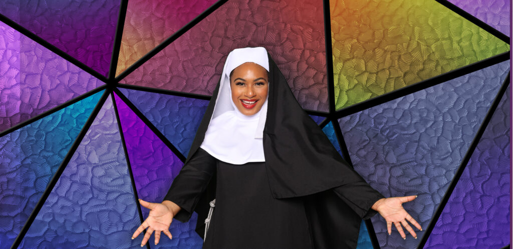 Picture of a Black woman in a nun's habit in front of a stained glass background.