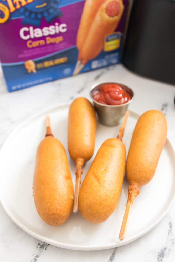 State Fair Corn Dogs with dipping sauce on plate.