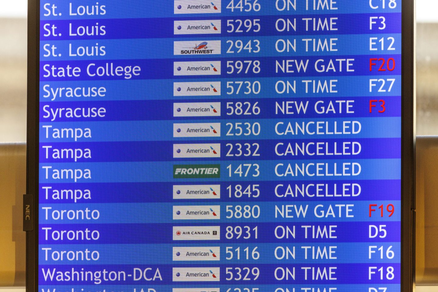 Flight information board with cancelled flights to Tampa is shown on Wednesday, Oct. 9, 2024 at the Philadelphia International Airport.