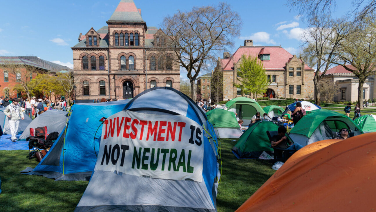 Brown University students call for divestment from their pro-Palestinian encampment on the campus’ Main Green in Providence, Rhode Island, April 24, 2024. (Anibal Martel/Anadolu via Getty Images)