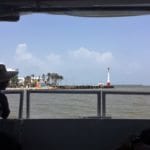 A group on a Galveston Cruise boat admiring the water.