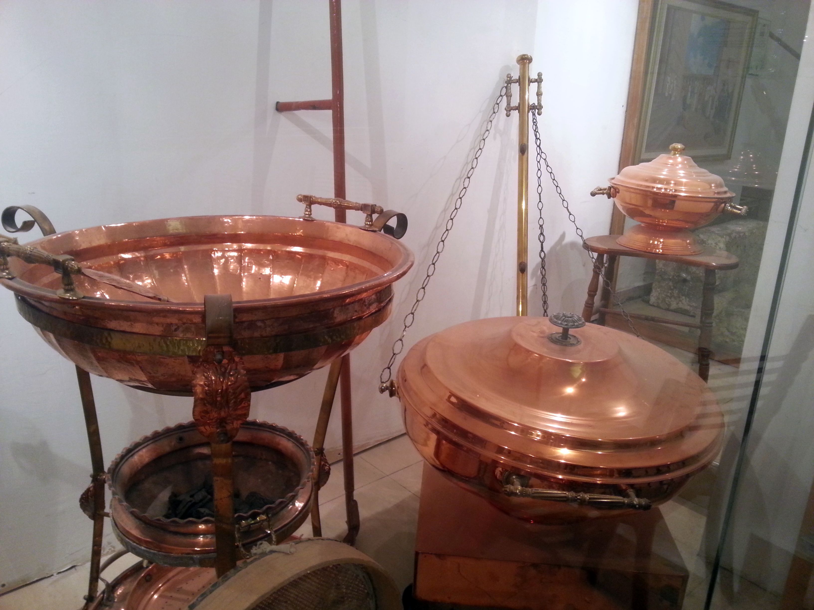 Copper vessels for the Third Temple:  On the left is the Abuv, a three-
tiered stand used for roasting the Omer on Passover.  The middle tier contains coal for roasting the barley.  On the far right toward the back is the copper vessel used in preparing the meal offering.