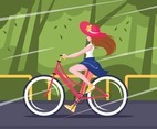 Beautiful Woman Riding Bicycle on the Road Bike