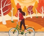 Woman Rides a Bike at Park in Autumn