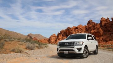 parked white ford explorer suv