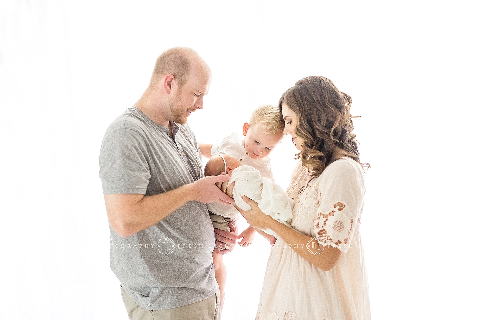 Mom and Dad holding children