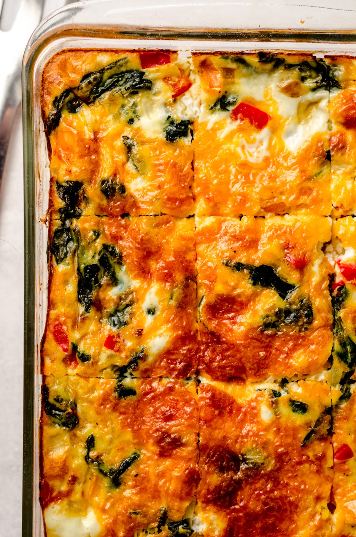 aerial photo of a sliced make ahead breakfast casserole in a baking dish