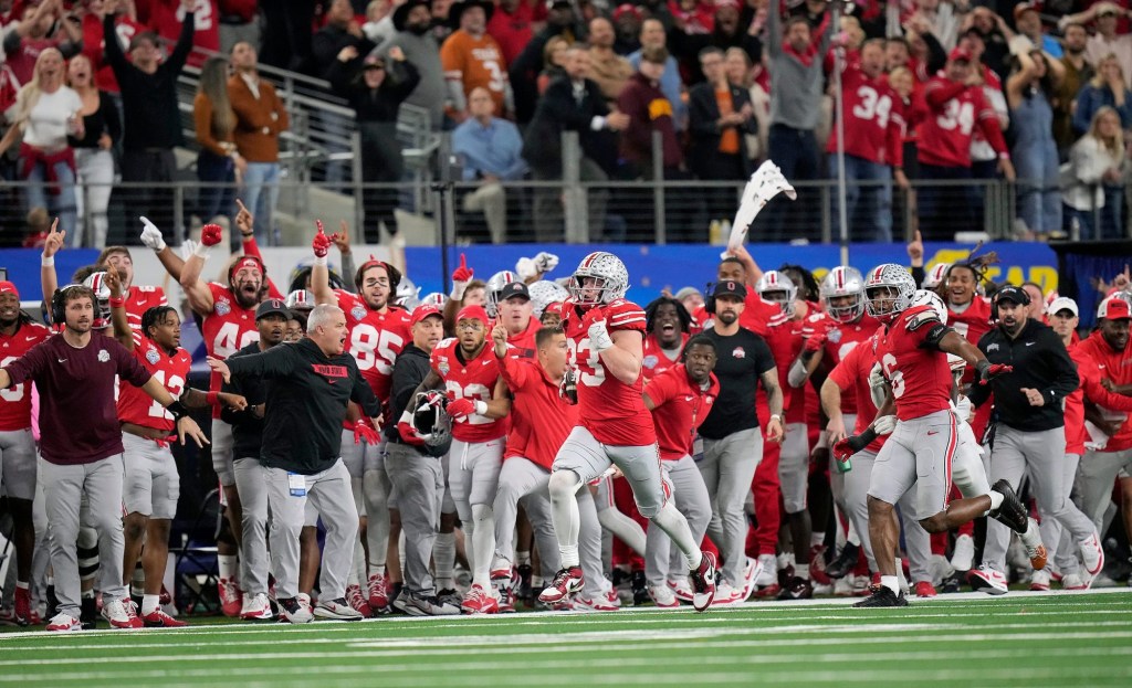 Ohio State Buckeyes defensive end Jack Sawyer (33) knocks the ball out of the hands of Texas Longhorns quarterback Quinn Ewers (3) and returns the fumble for a touchdown in the fourth quarter of the Cotton Bowl Classic during the College Football Playoff semifinal game at AT&T Stadium in Arlington, Texas on January, 10, 2025.