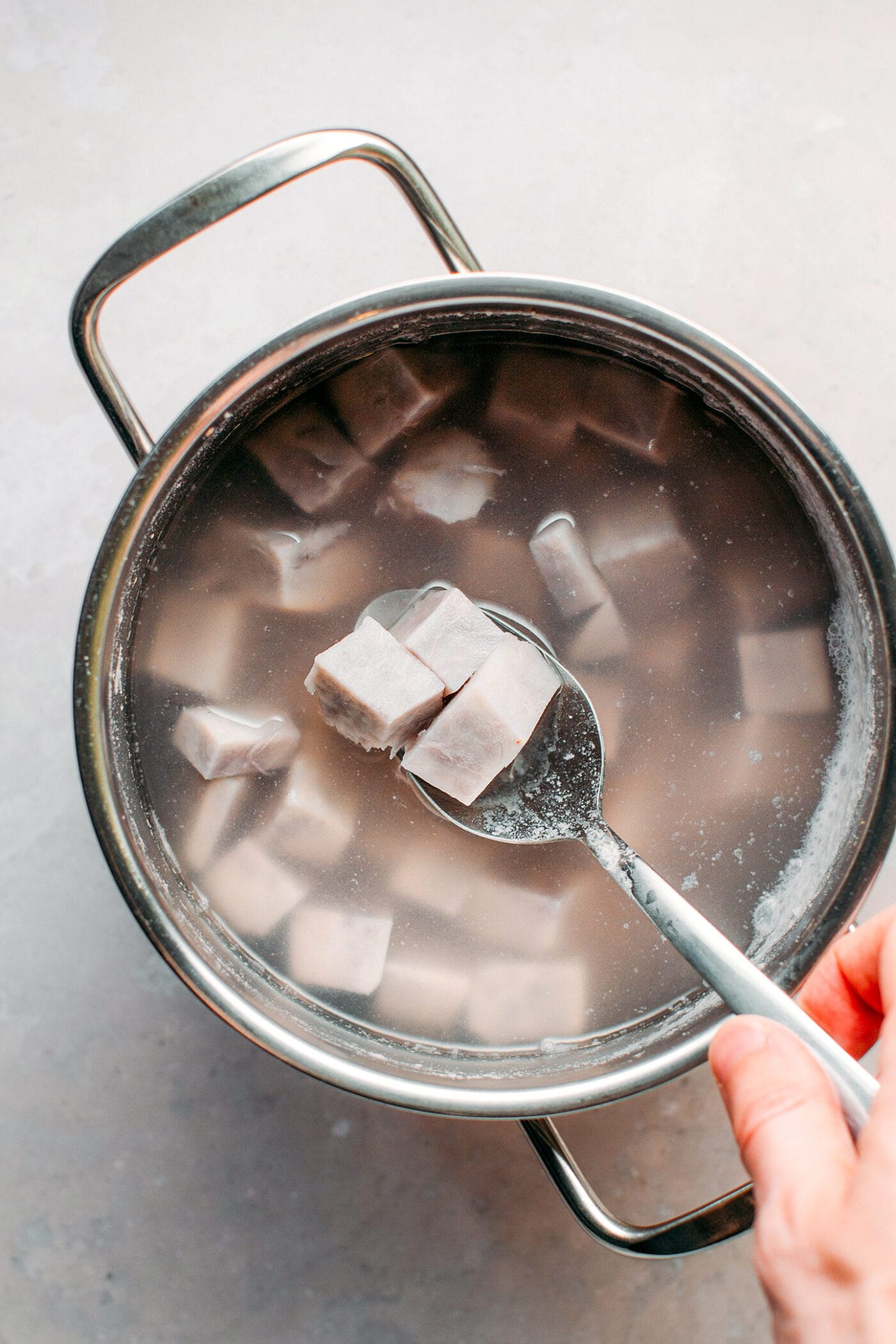 Boiled taro in a saucepan.