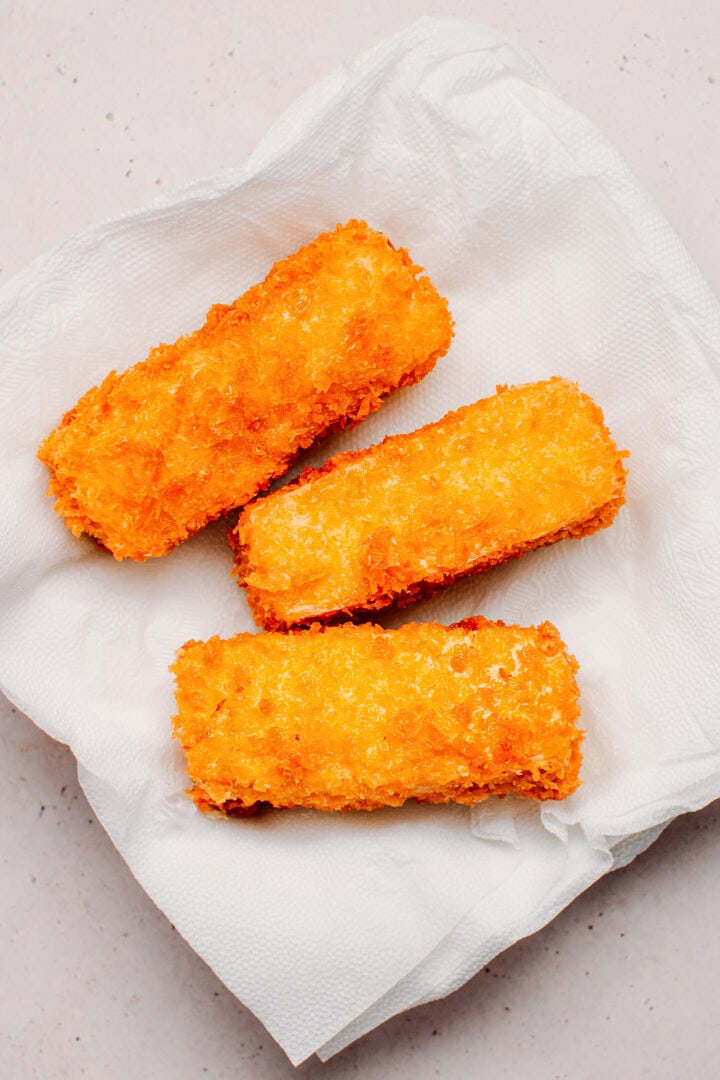 Fried panko tofu on kitchen paper towels.