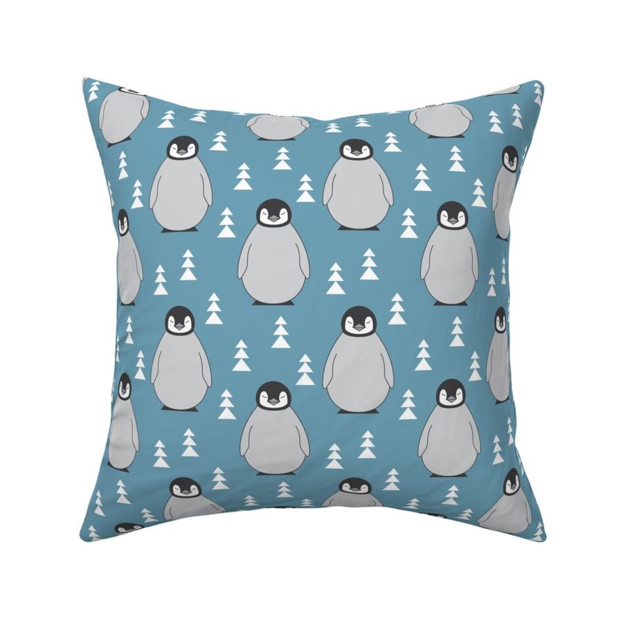 large penguins with triangle trees on blue