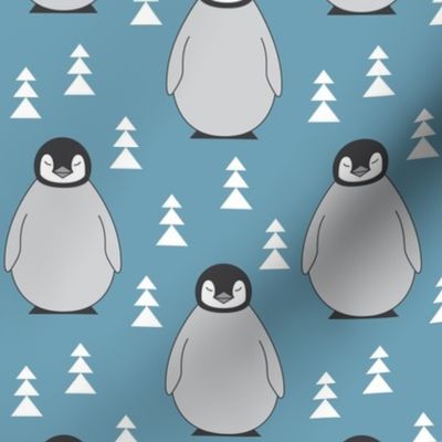 large penguins with triangle trees on blue