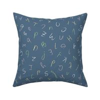 Alphabet of cursive brush stroke letters on navy blue - medium