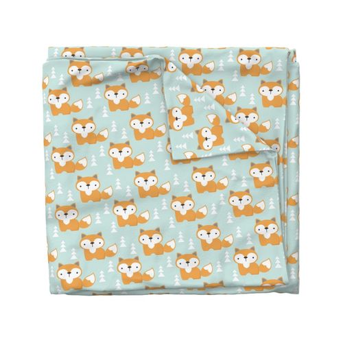 foxes on soft turquoise