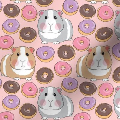 guinea pigs with pink purple and chocolate donuts