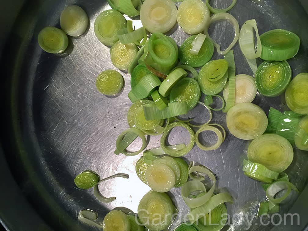 Place your leeks or other onions in a pan with two tablespoons of olive oil. Cook until they start to brown.