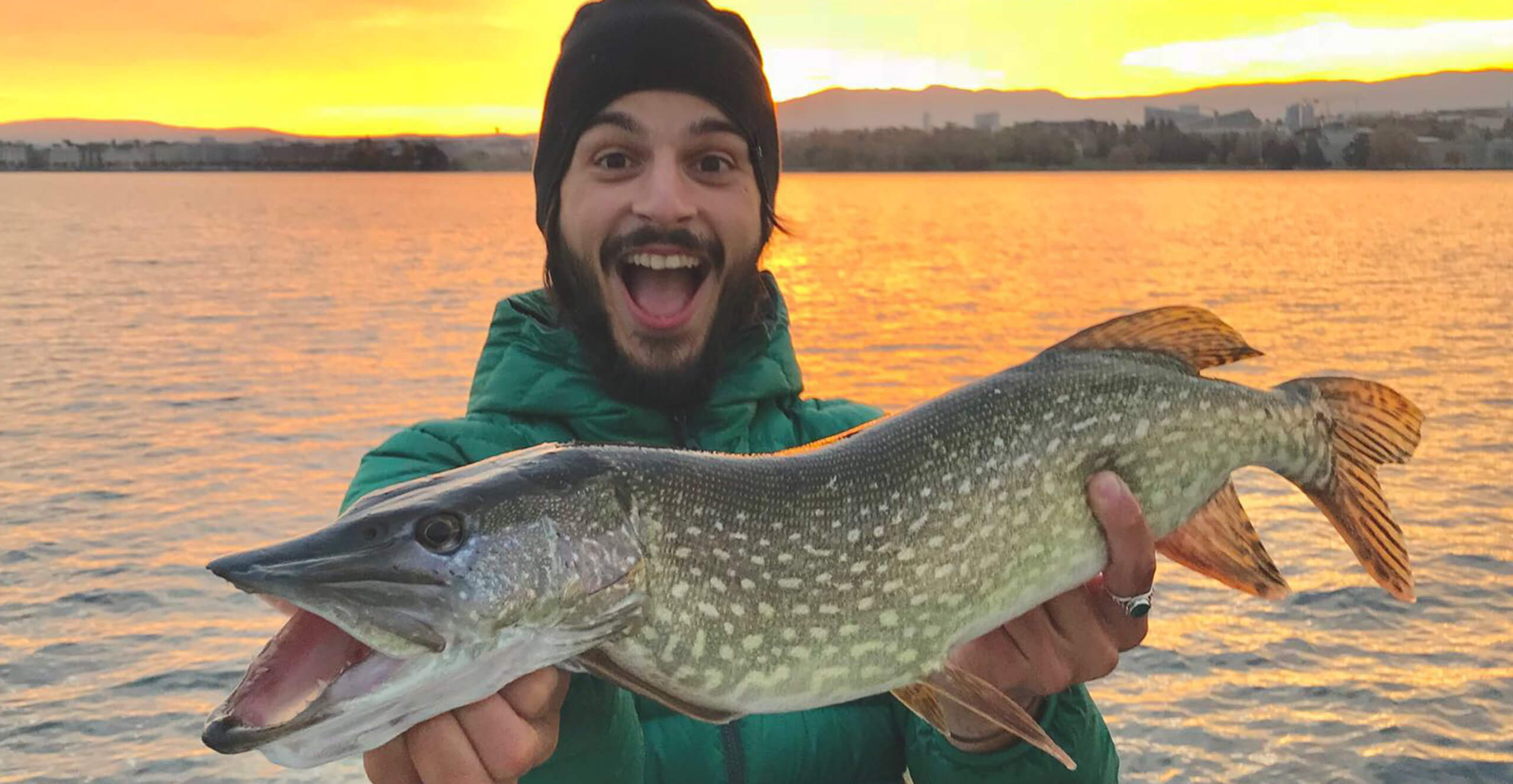 A fisherman showing a big pike - Geneva boats