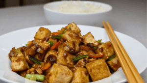 Kung pao tofu is a delicious and popular Chinese dish that originated in the Sichuan province. It is a flavorful and spicy stir-fry made with tofu, peanuts, vegetables, and a variety of sauces.