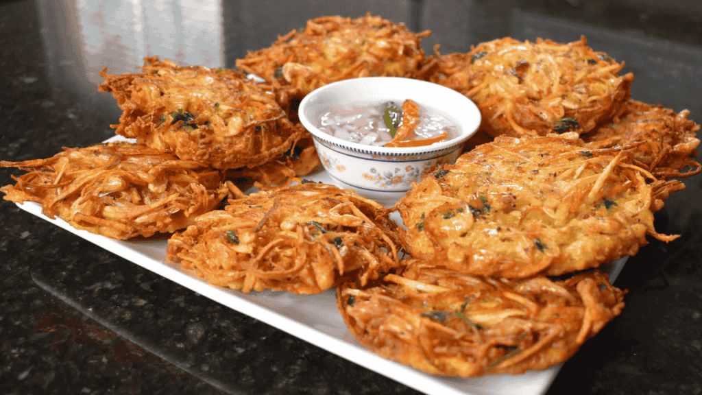 Okoy, also known as shrimp fritters, is a popular Filipino snack or appetizer made with small shrimp and vegetables mixed in a batter and then deep-fried. It is usually served with soy sauce or vinegar for dipping.