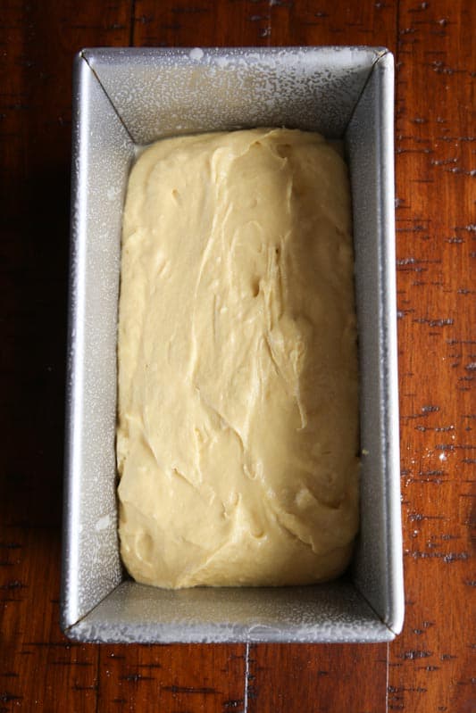 Gluten-free bread dough in greased loaf pan.