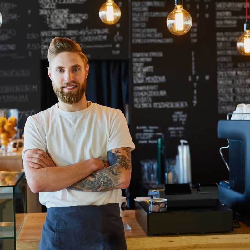 young man working at cafe