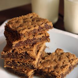 glasses of milk by plate of cookies