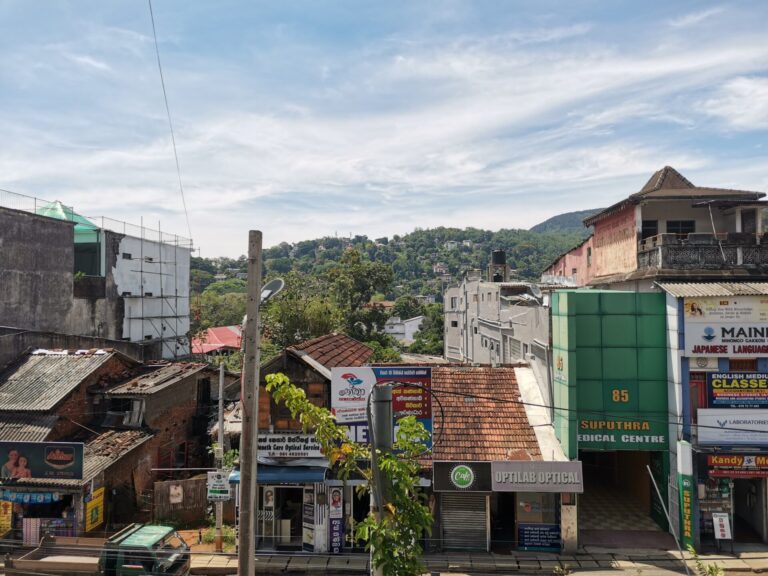 Various buildings in a row on a street in Kandy, Sri Lanka