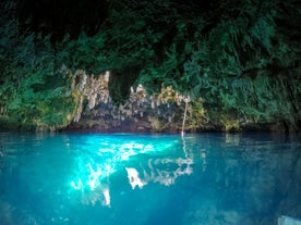 Swim inside Cabagnow Cave's turquoise waters