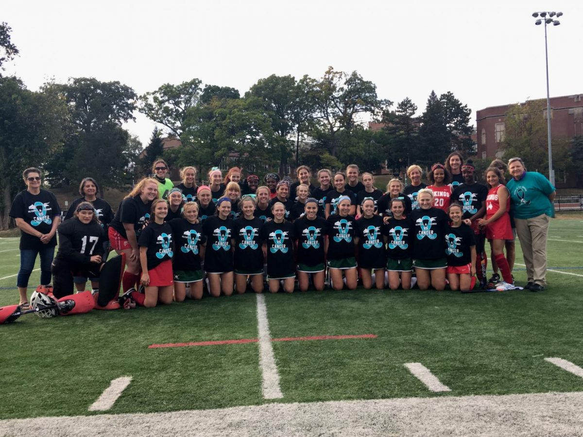 West's varsity field hockey team with Homewood Flossmoor's Vikings. Coach Leah Carter, in whose honor the event was started, is on the far right.