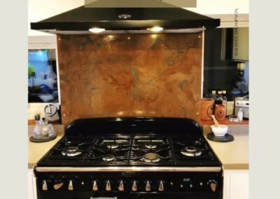 glossy aged copper kitchen splashback