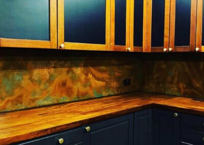 aged copper backsplash without much patina coming through