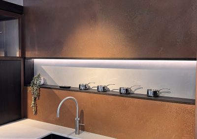 copper splashback and wall panel in minimalist kitchen